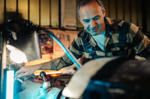 GETEEN mechanic smiles, happy that his machine is working properly.